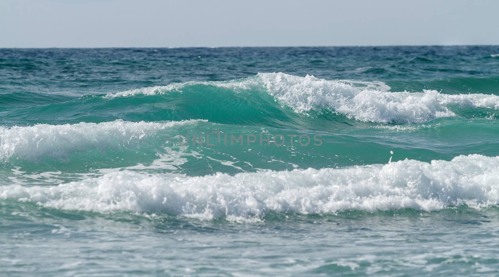 Beautiful tidal waves against the sky. Seascape.