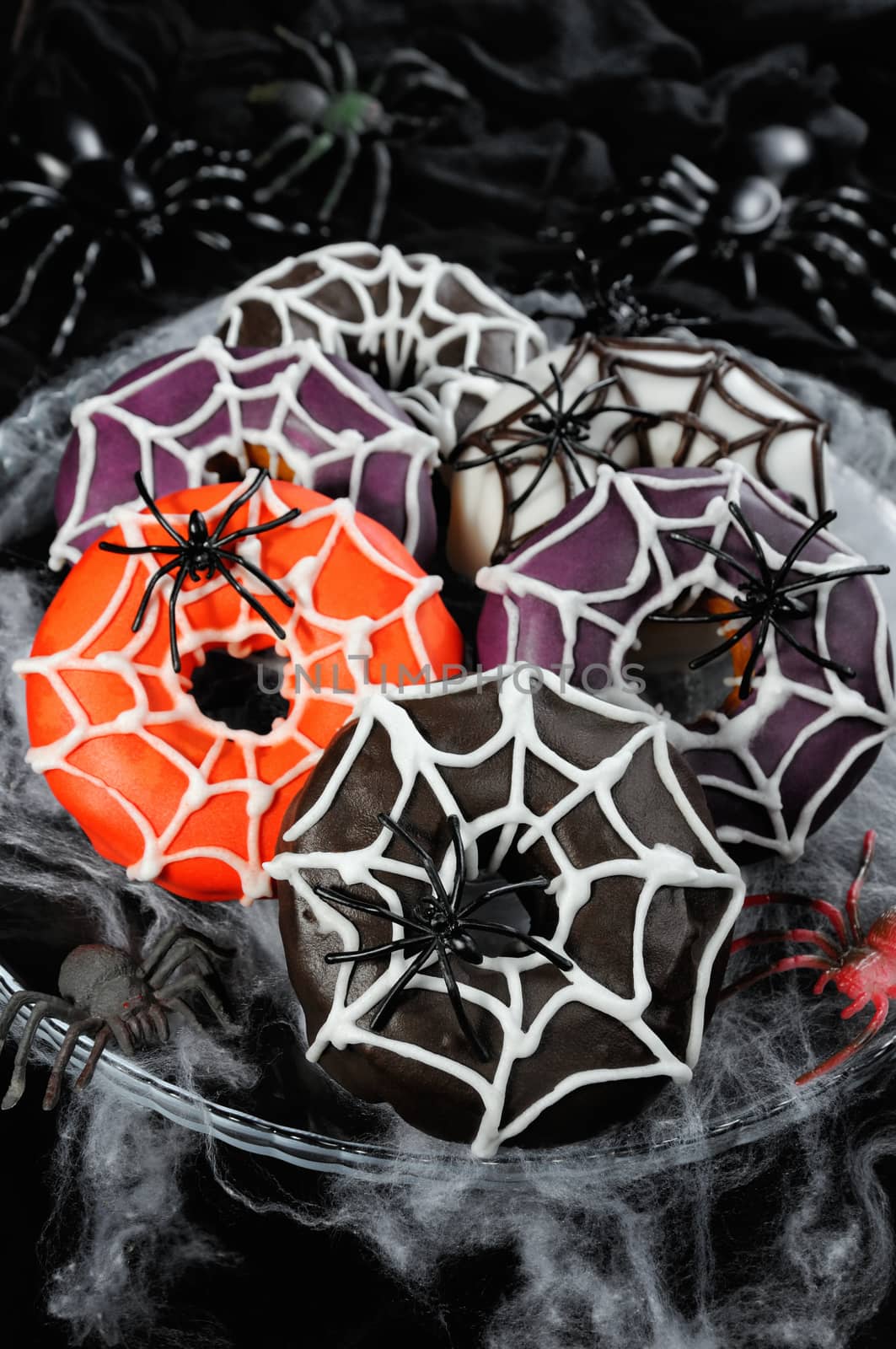 Glazed donuts decorated with cobwebs for Halloween