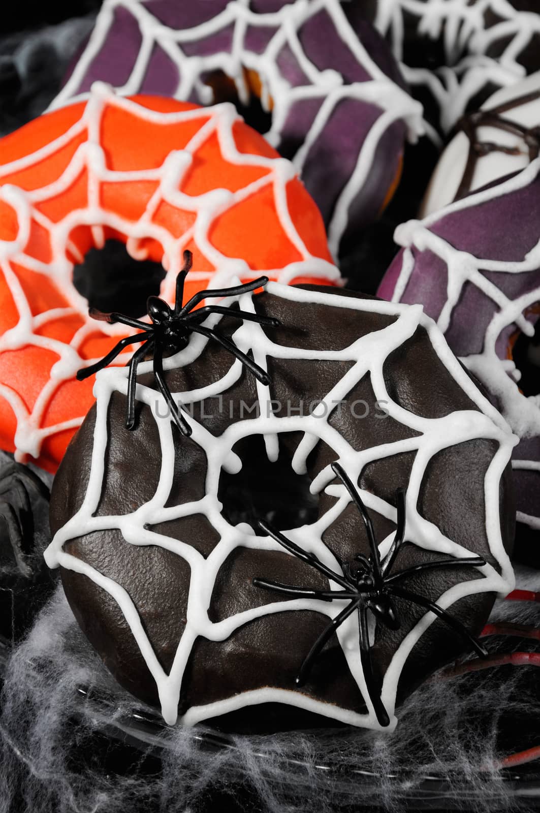 Glazed donuts decorated with cobwebs for Halloween