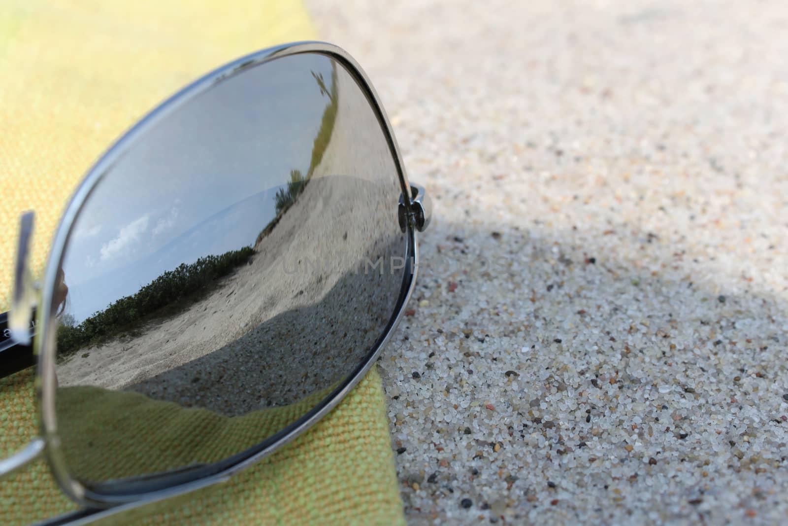 sea landscape reflecting in the sunglasses on the beach by Kasia_Lawrynowicz