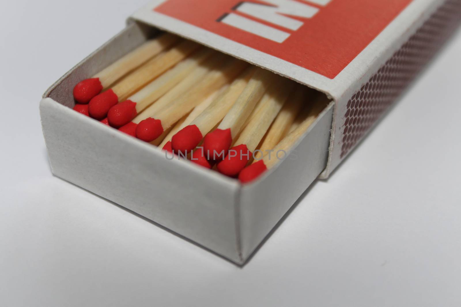 Matches in a box on a white background. by Kasia_Lawrynowicz