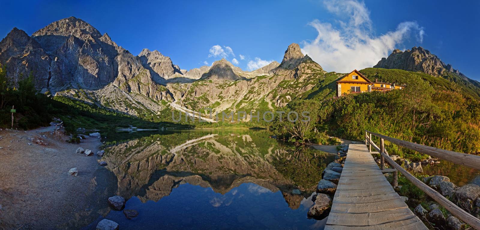 Alpine lake Zelene pleso in the morning with a great view on Tatra mountains.