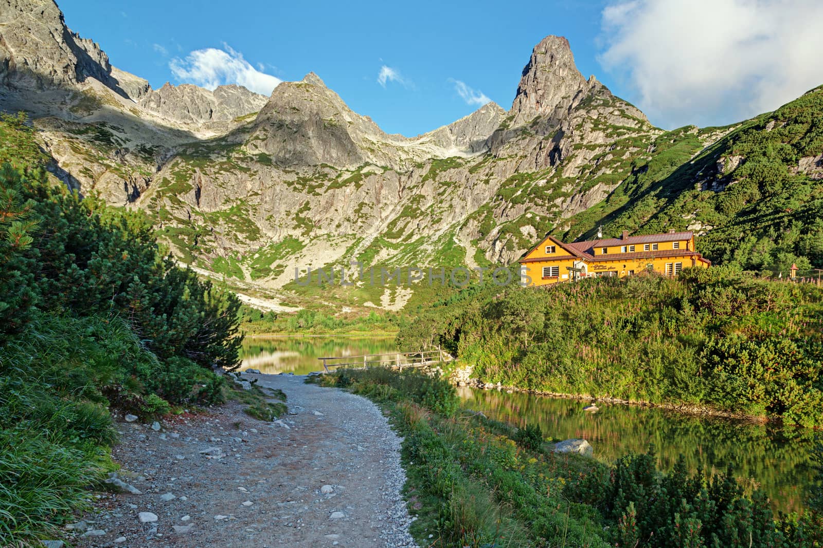 Alpine lake Zelene pleso in the morning with a great view on Tatra mountains.