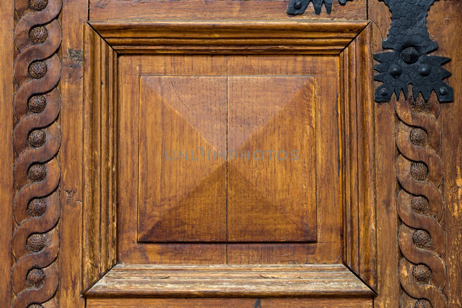 Close up of rustic old door in Assisi, Italy.