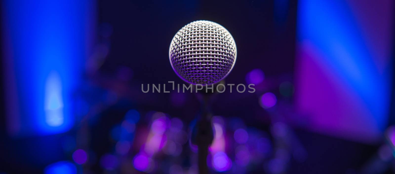 Microphone on stage against a background of auditorium, France