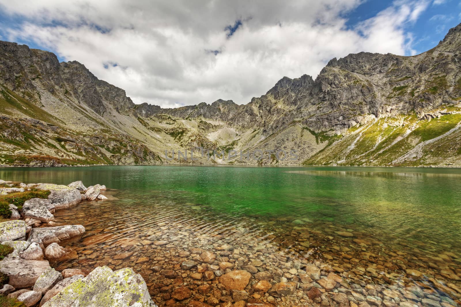 Alpine lake Velke Hincovo Pleso, with a great view on High Tatra mountains.