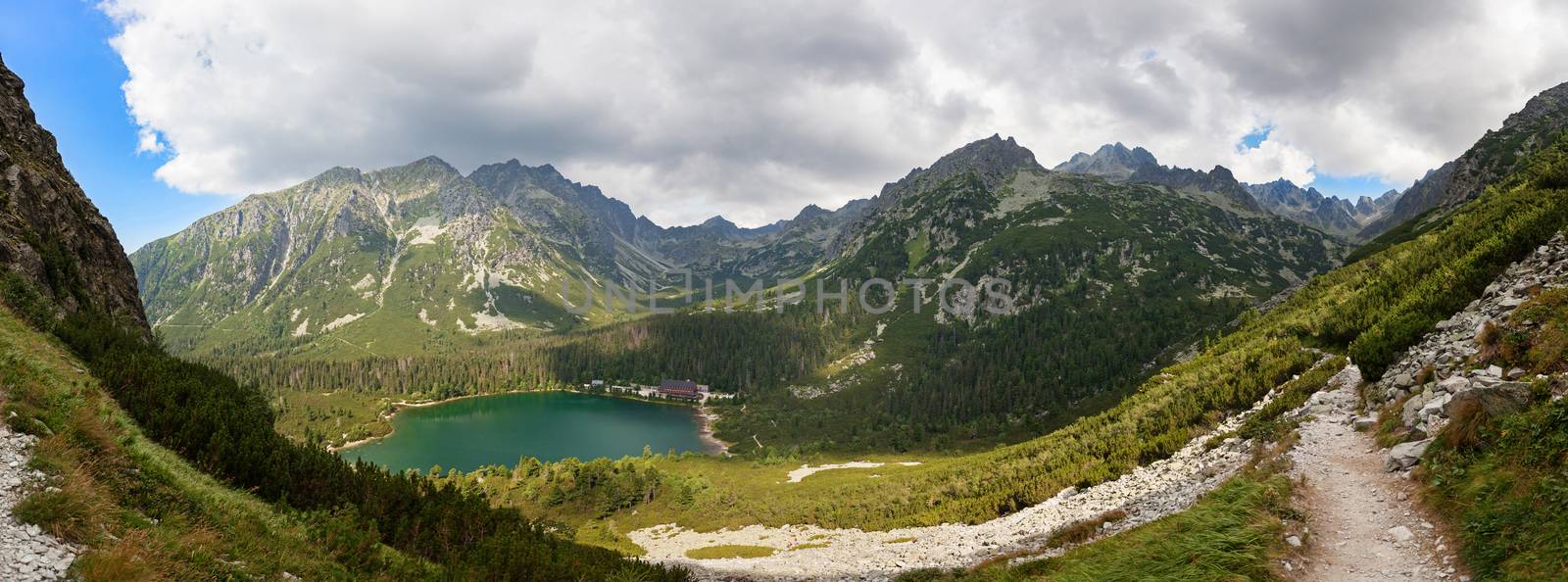 Alpine lake Popradske pleso in the morning with a great view on Tatra mountains.