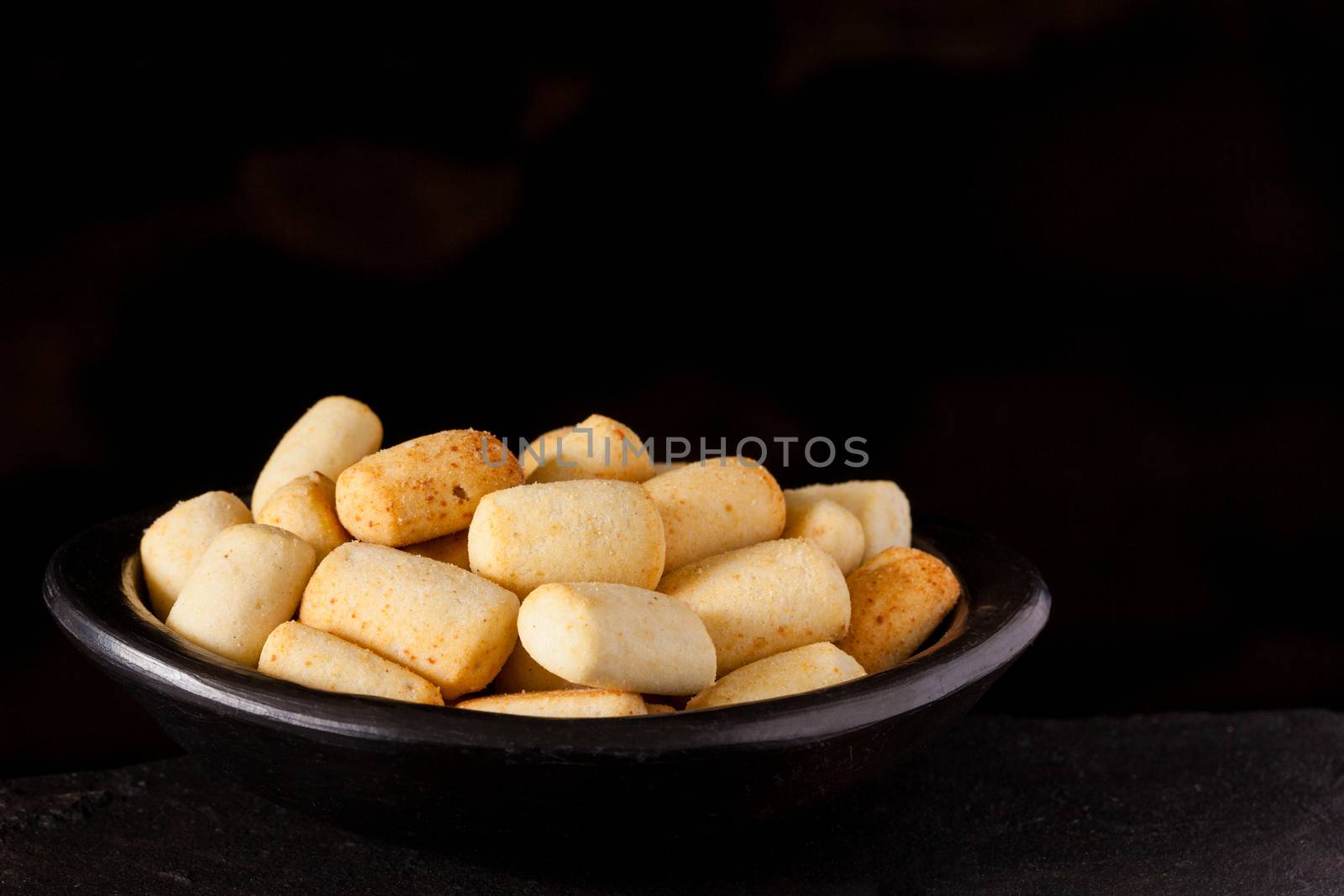 Traditional snack from Colombia called achira on black background