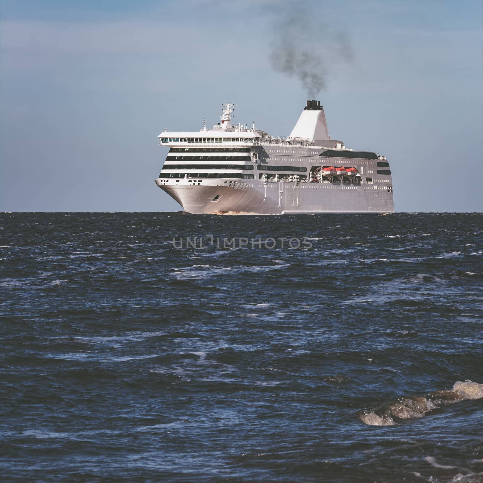 White passenger ship underway by sengnsp
