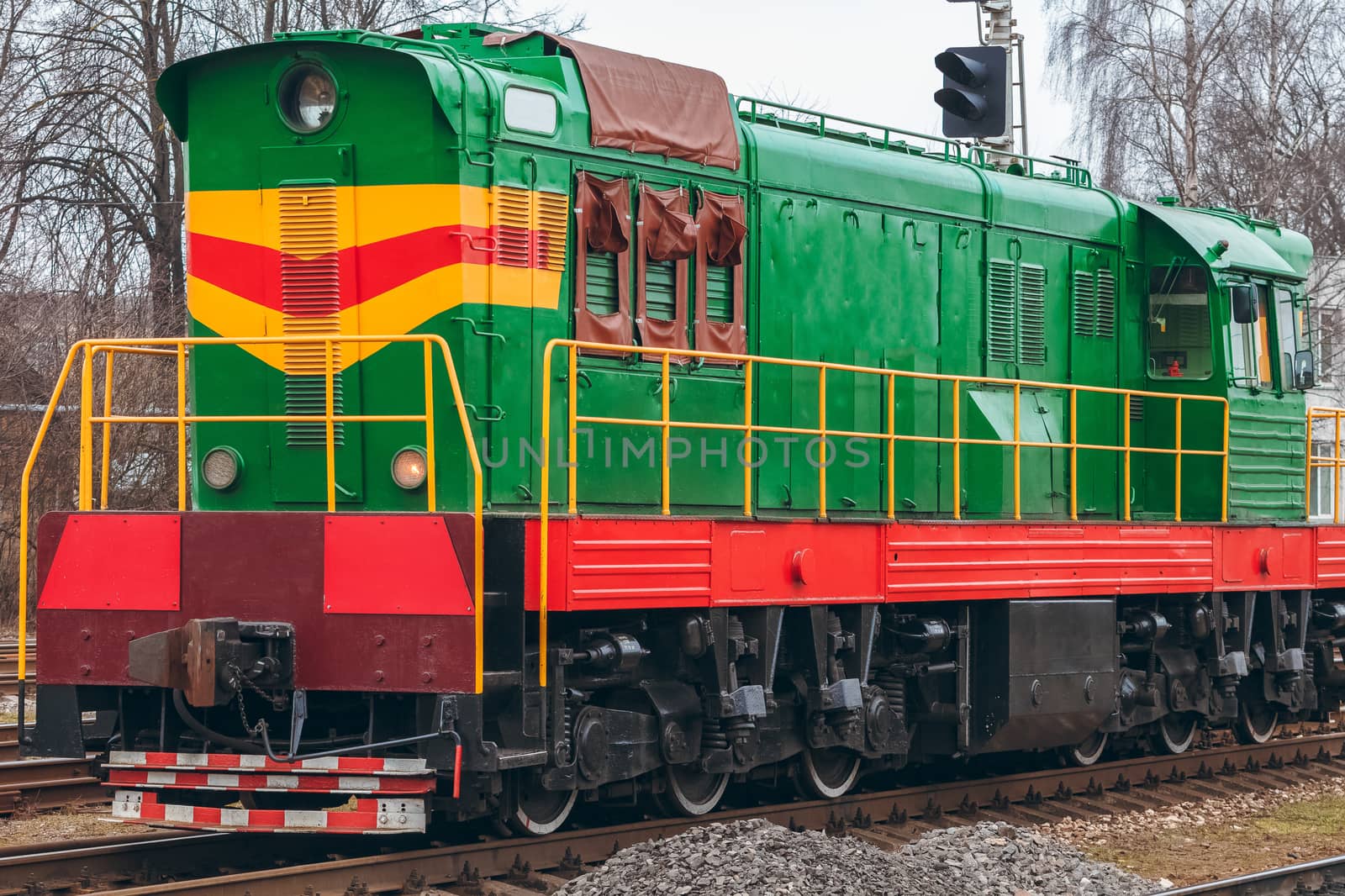 Green diesel cargo locomotive. Freight train in action