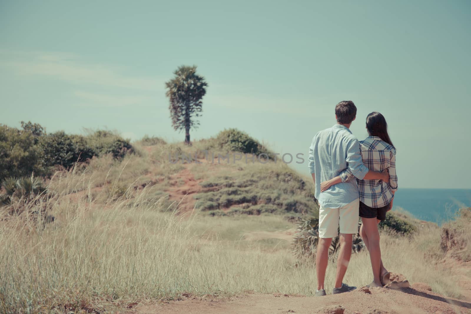 Young couple enjoy beautiful sea view on vacation