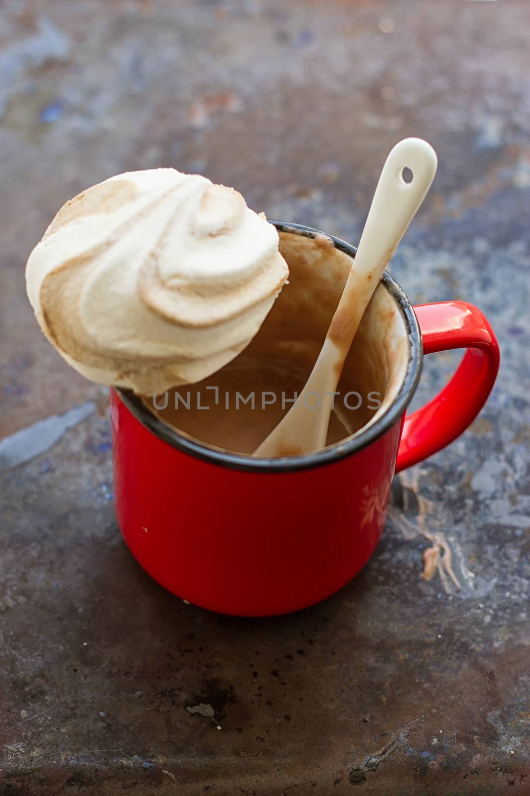 Cappuccino and chocolate marshmallows on a grunge background