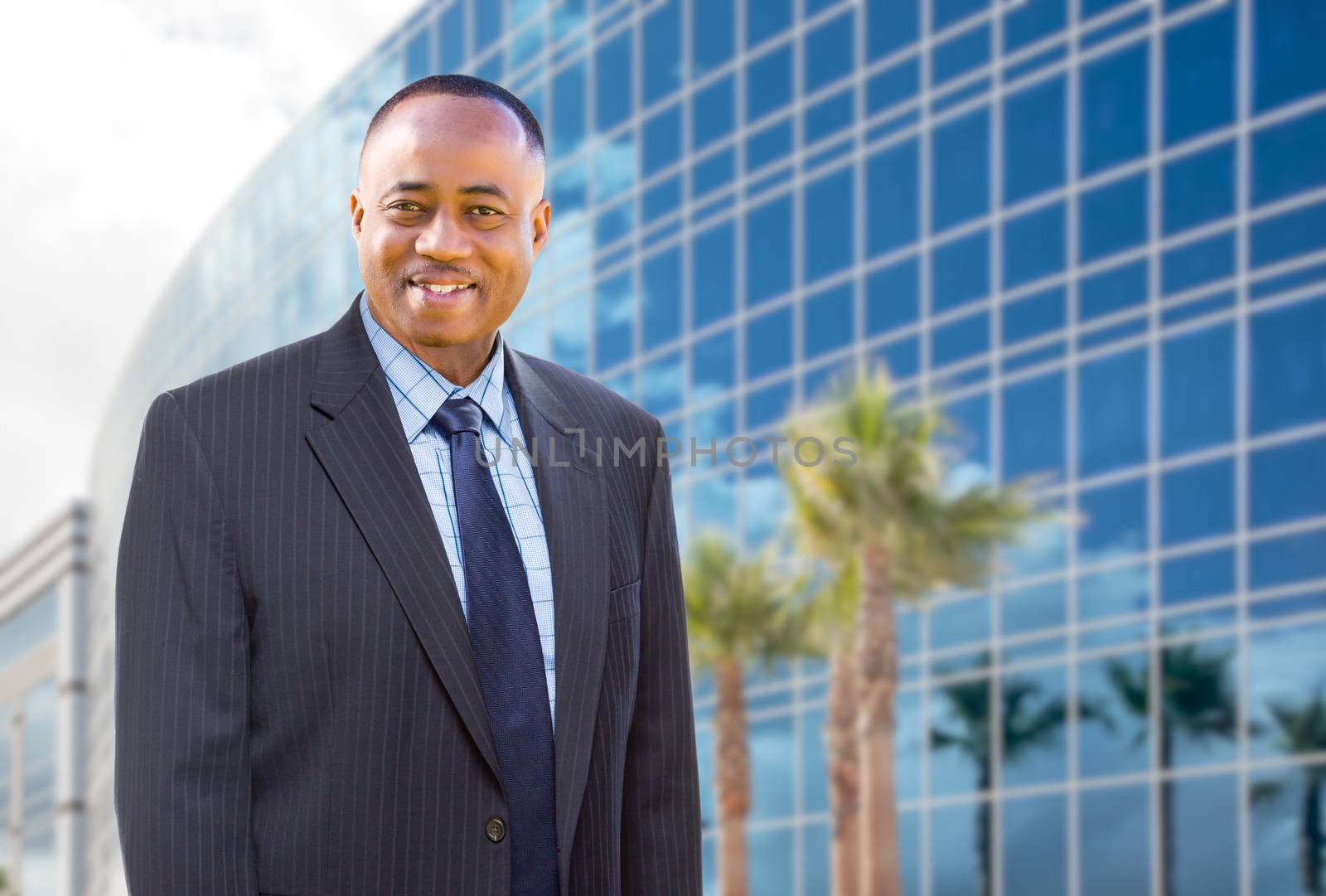 Handsome African American Businessman In Front of Corporate Building.
