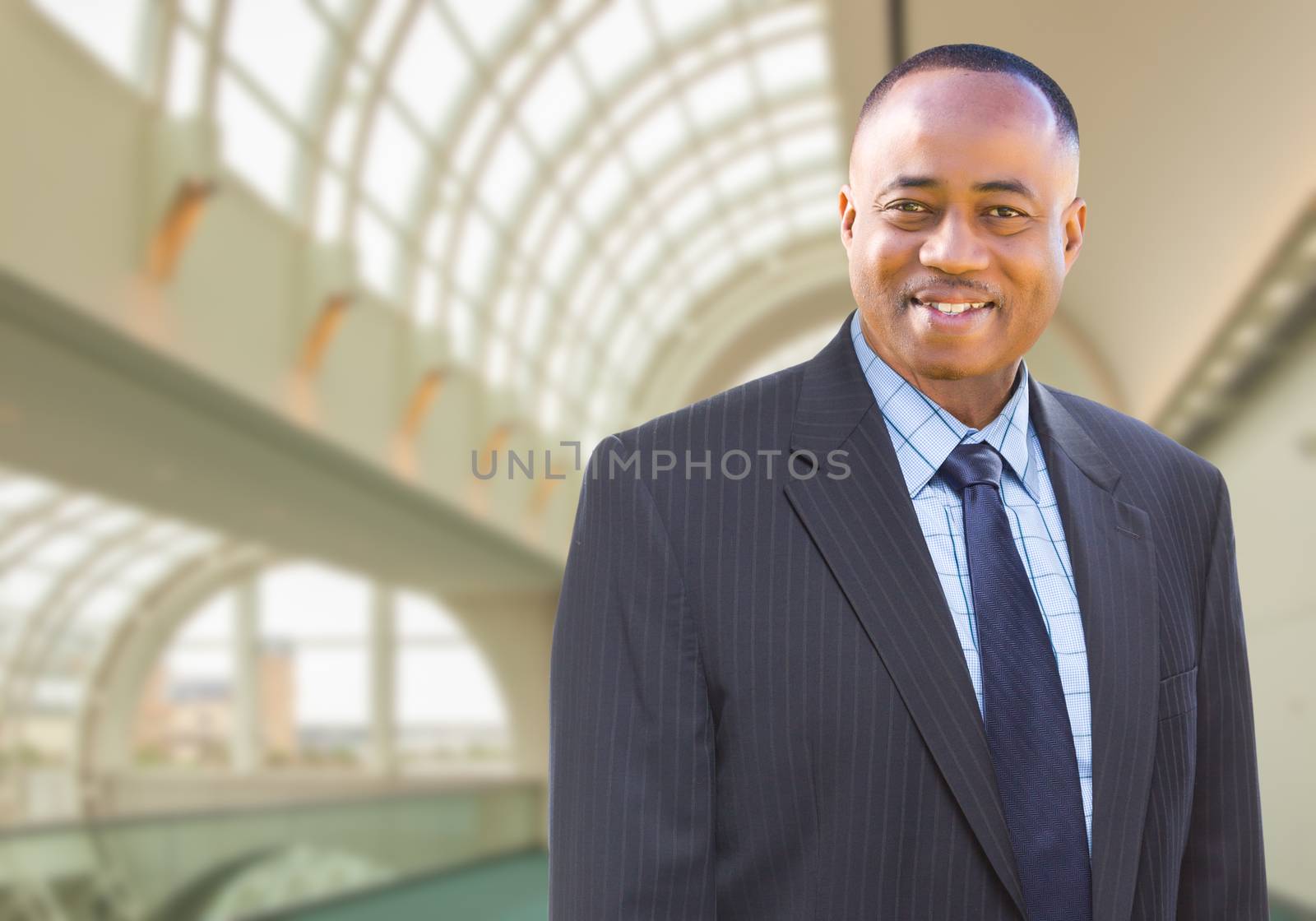 Handsome African American Businessman Inside Corporate Building.