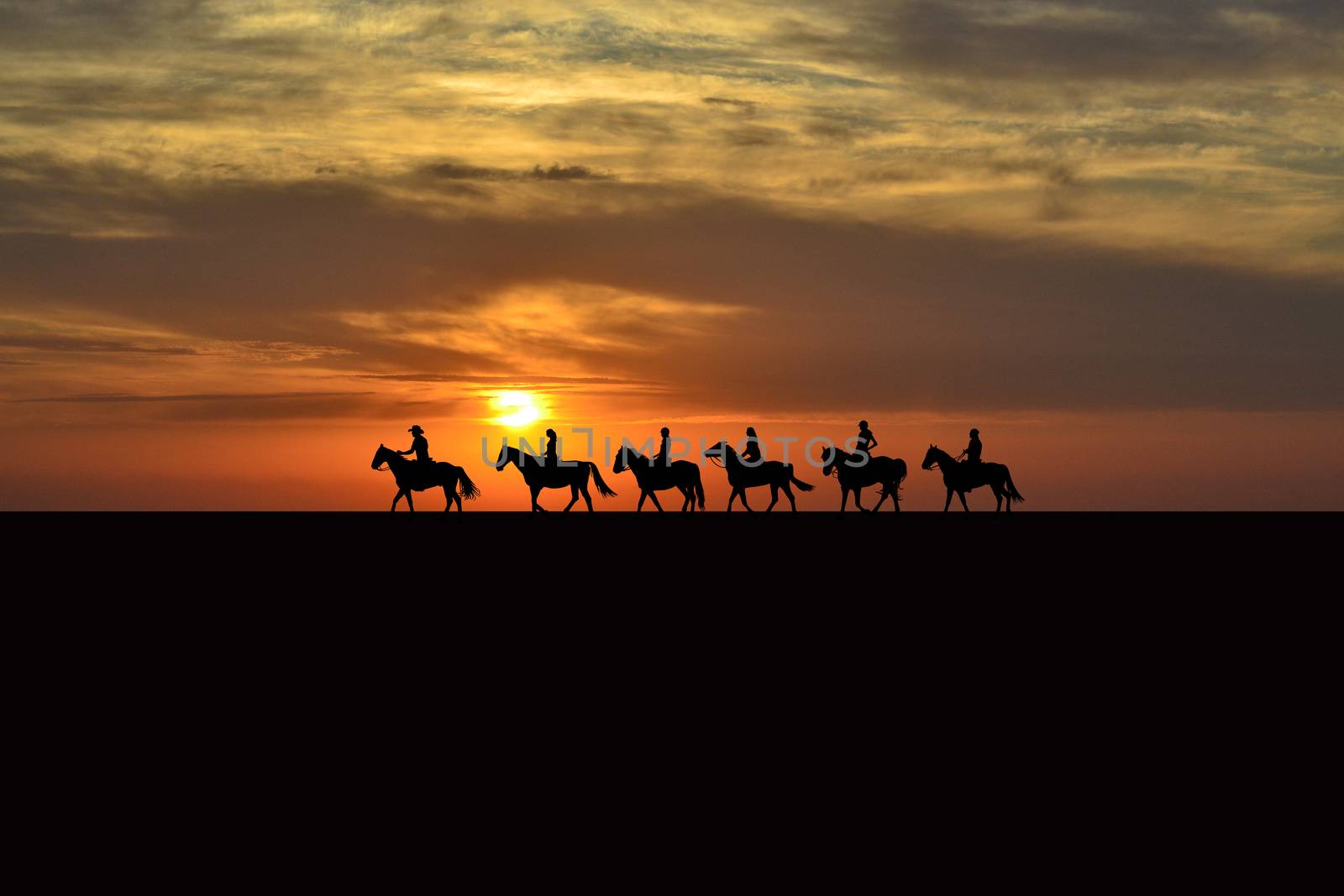 Horse rider silhouettes at sunset by hibrida13