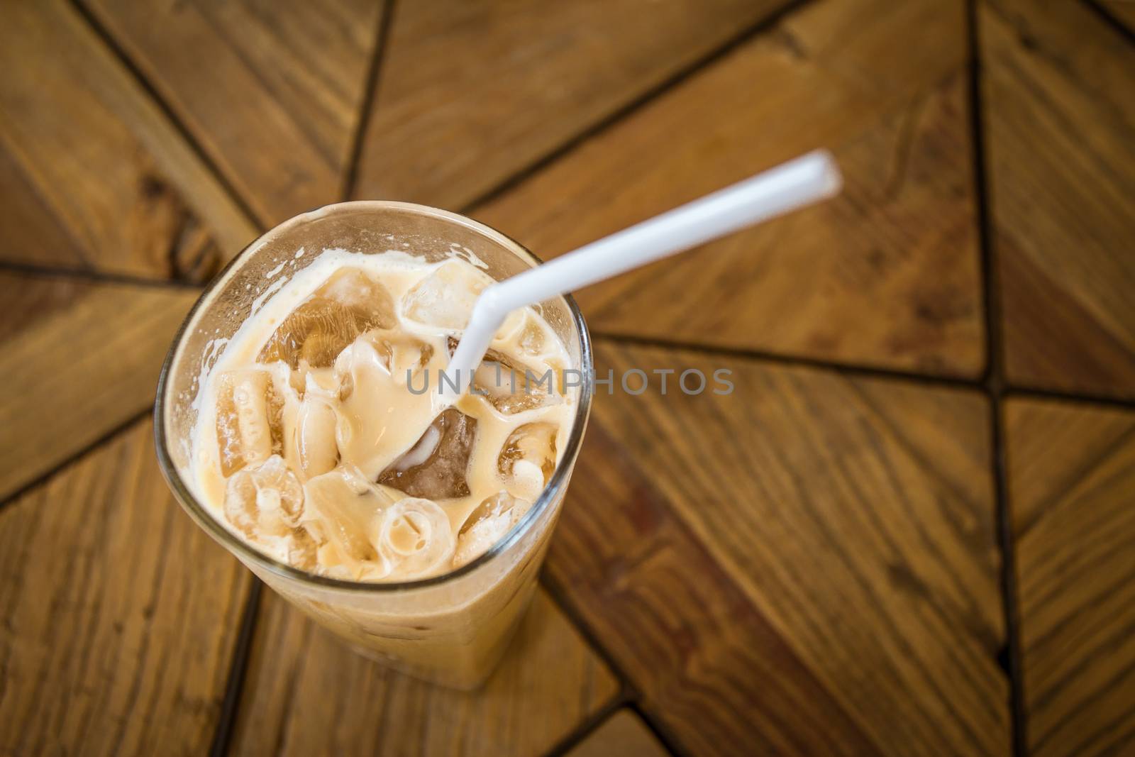 iced coffee glass on wooden table