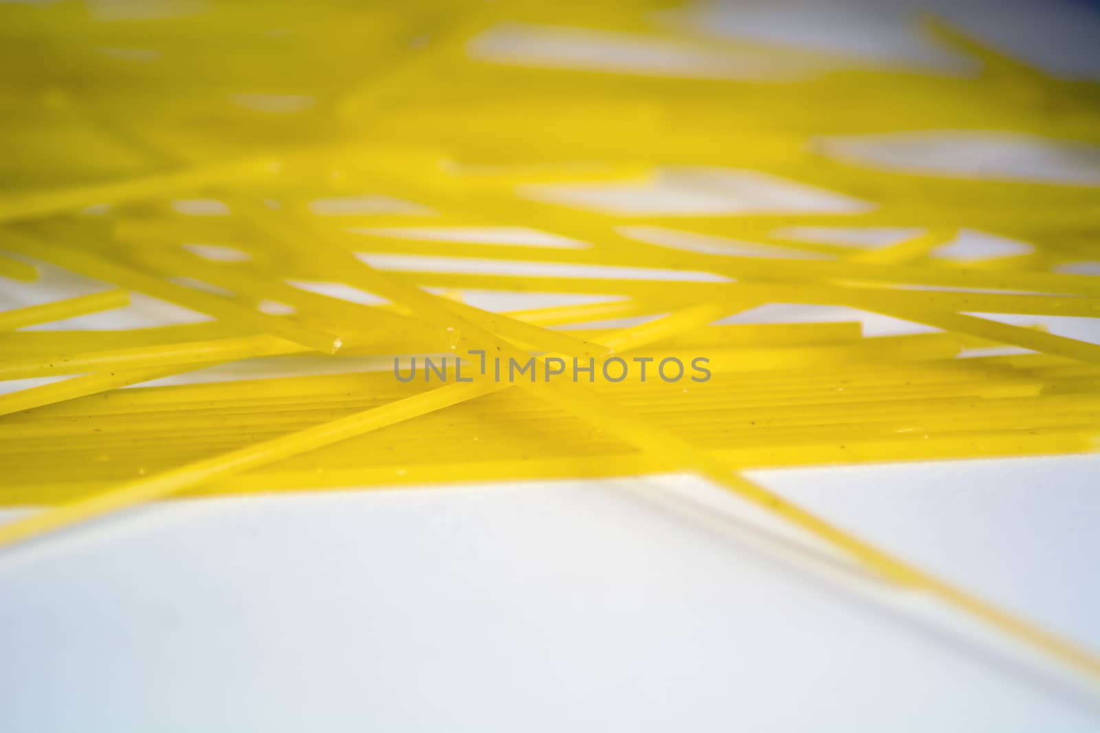 raw spaghetti pasta on a white background. Macro shot