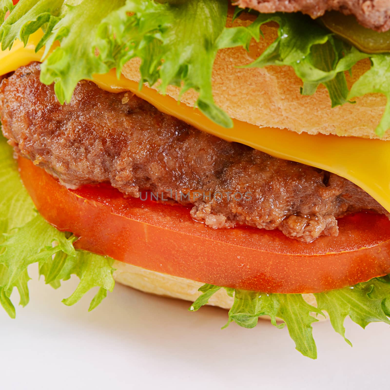 Hamburger with cutlet and cheese on white