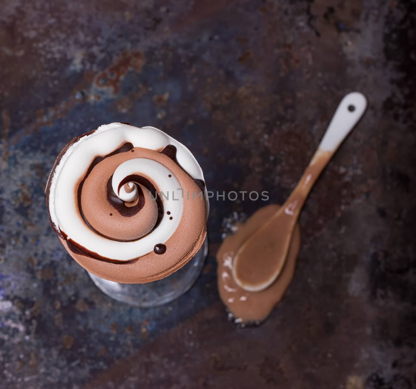 Wafer horn with chocolate ice cream and melted ice cream by victosha