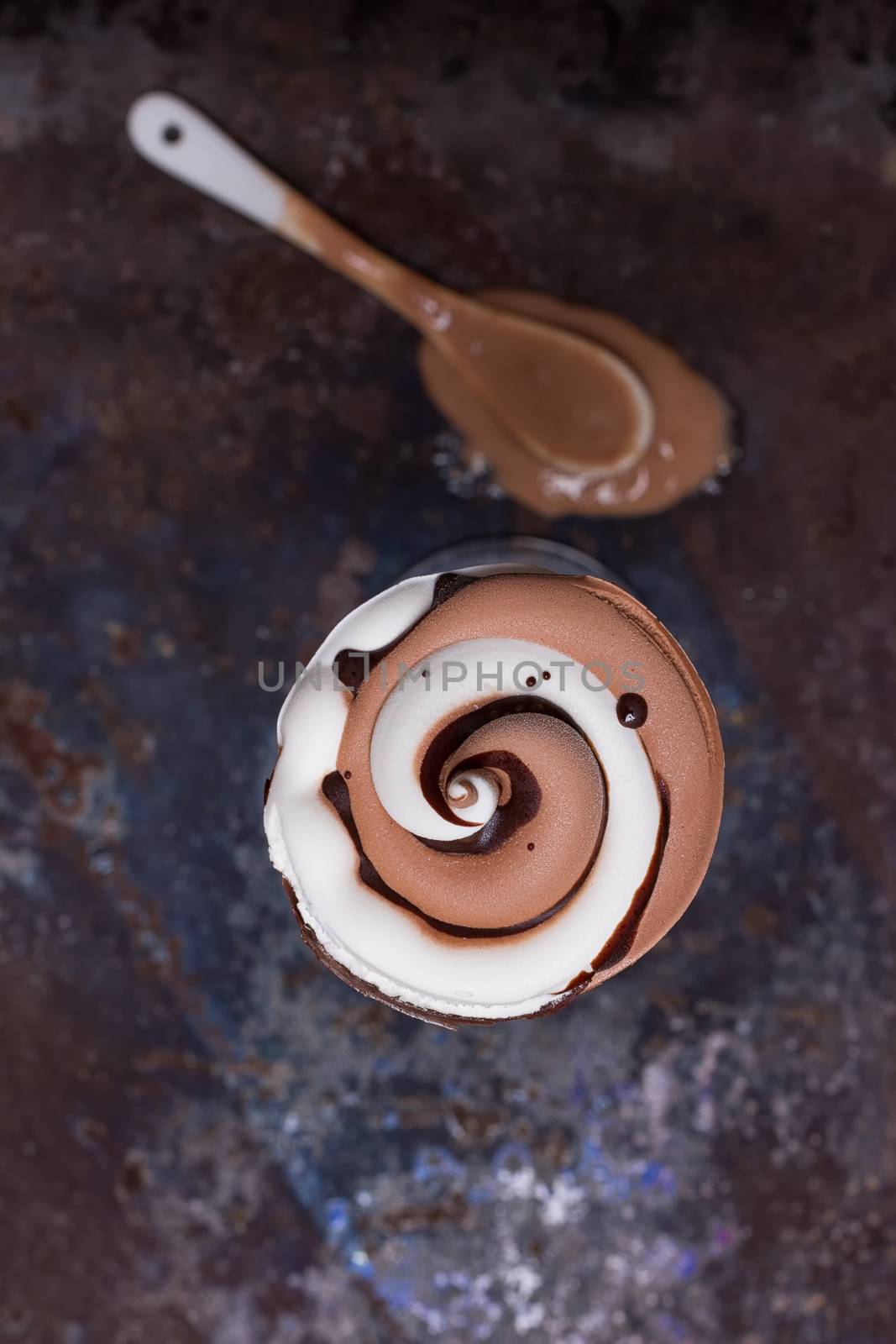 Wafer horn with chocolate ice cream and melted ice cream by victosha