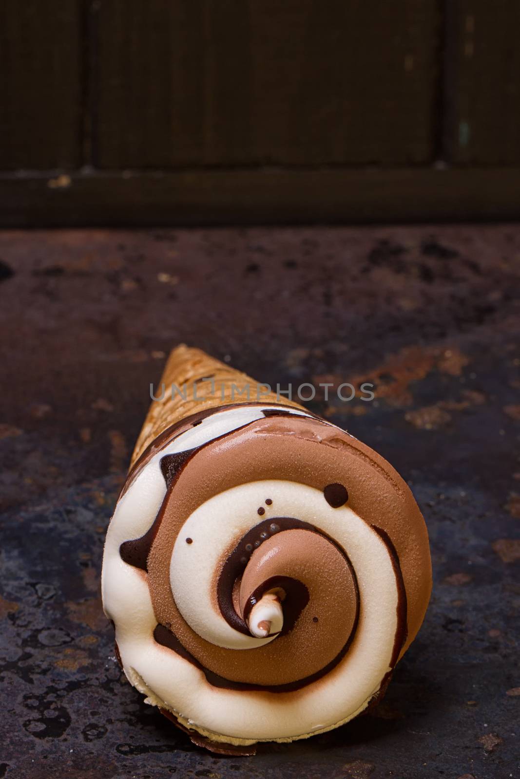 Vanilla ice cream cone with chocolate by victosha