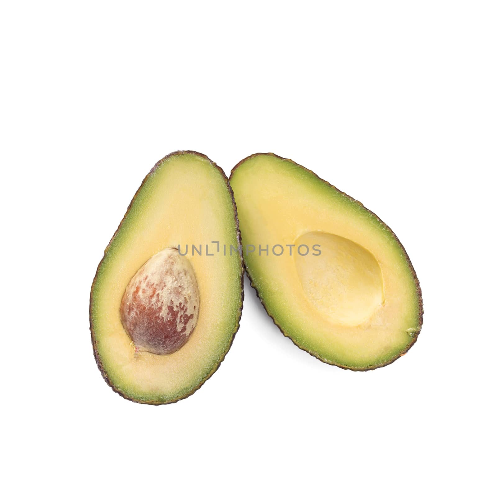 Two slices of avocado isolated on the white background. One slice with core. Design element for product label.