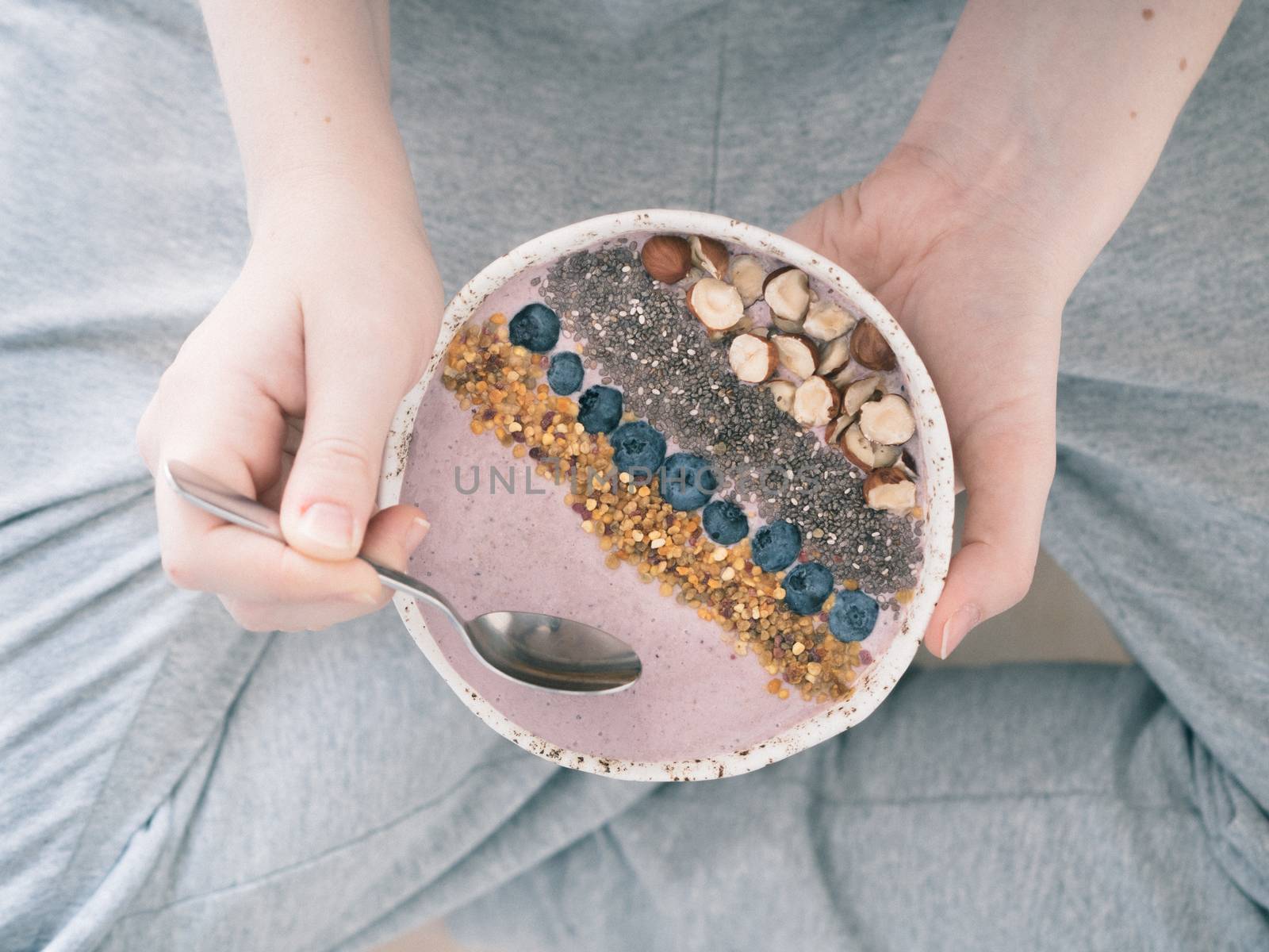 Breakfast bowl in woman hands by fascinadora