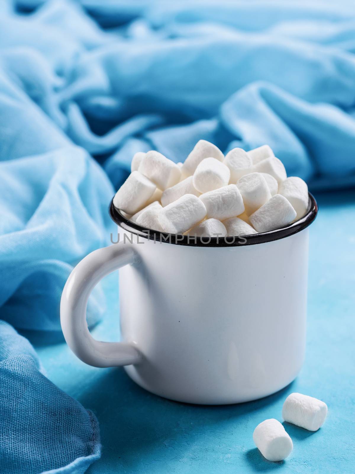 Marshmallows on blue background with copyspace by fascinadora