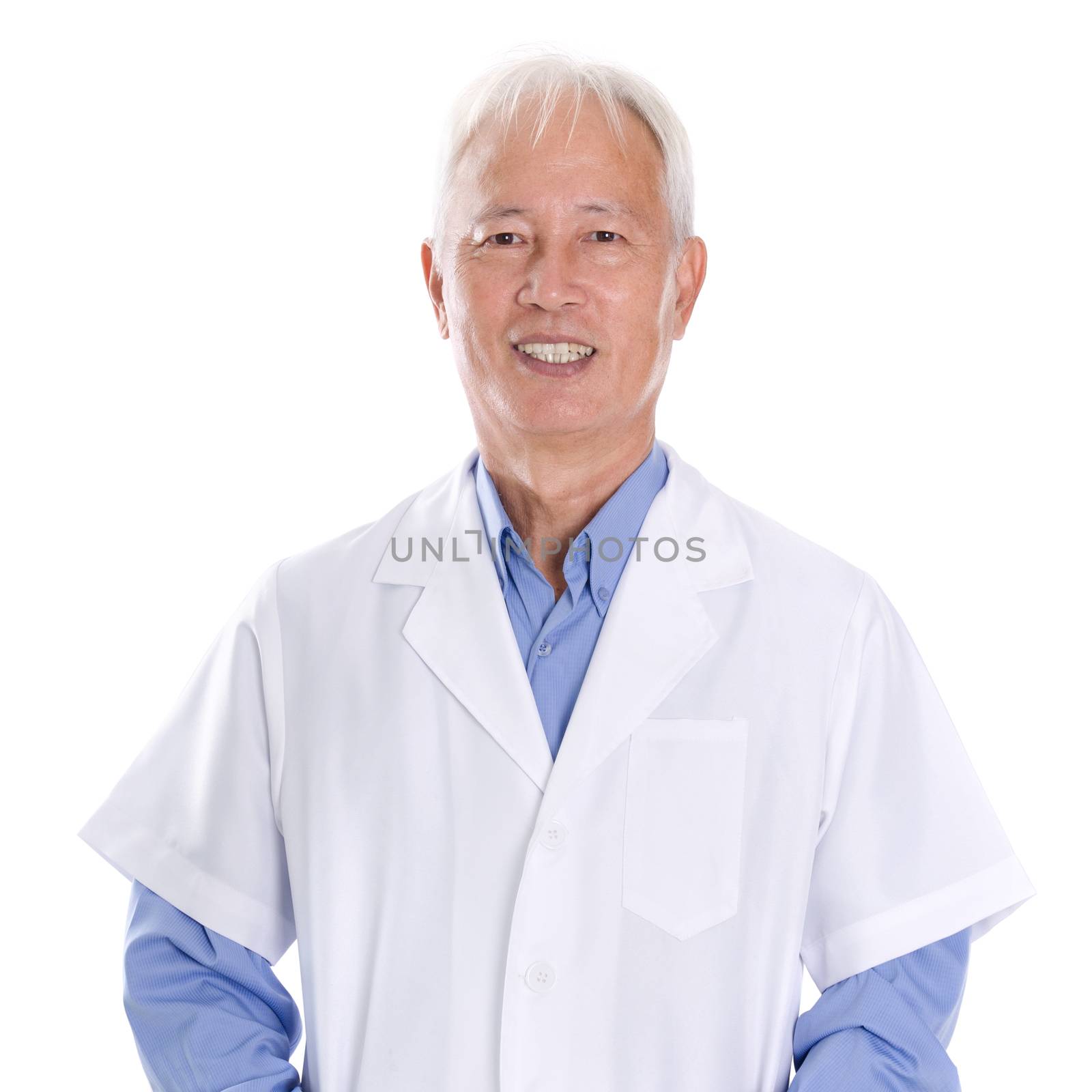 Portrait of friendly old Asian man in lab uniform smiling, standing isolated on white background.