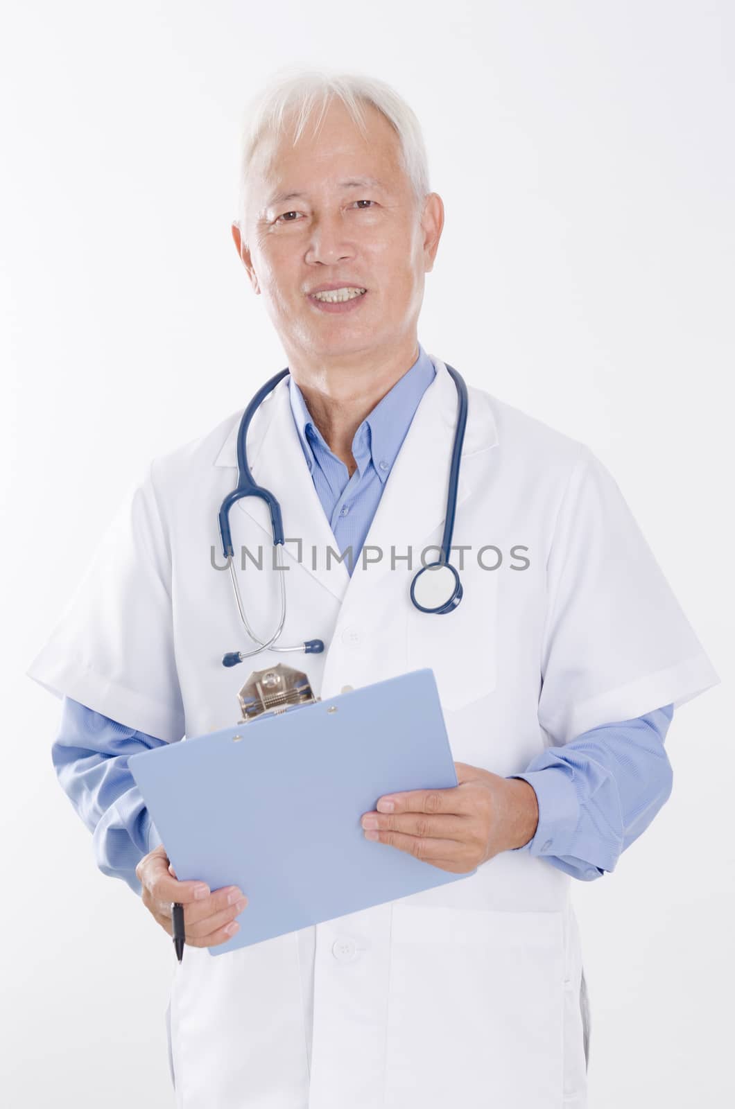Senior Asian medical doctor holding health report by szefei