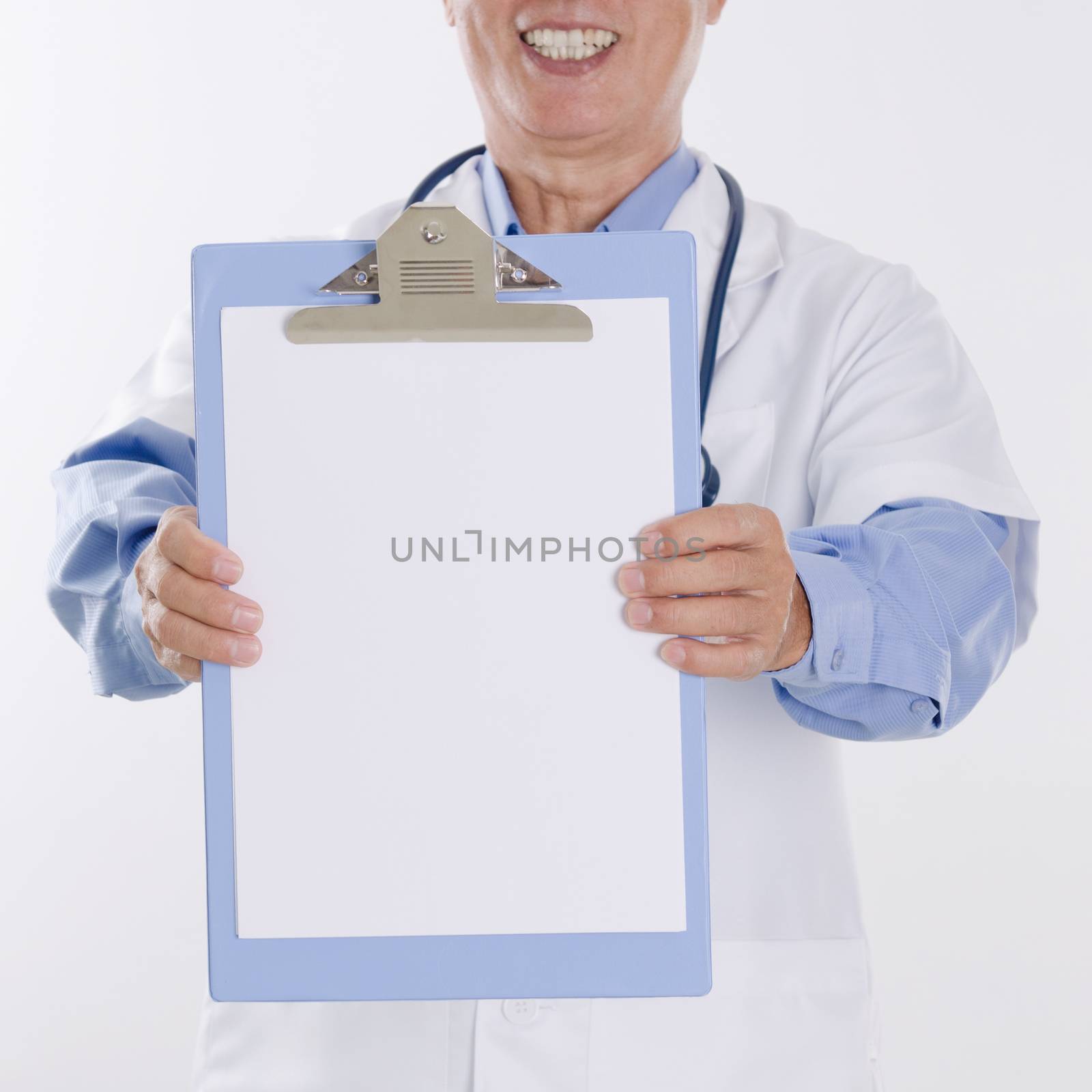 Portrait of medical doctor showing health report, standing isolated on white background.