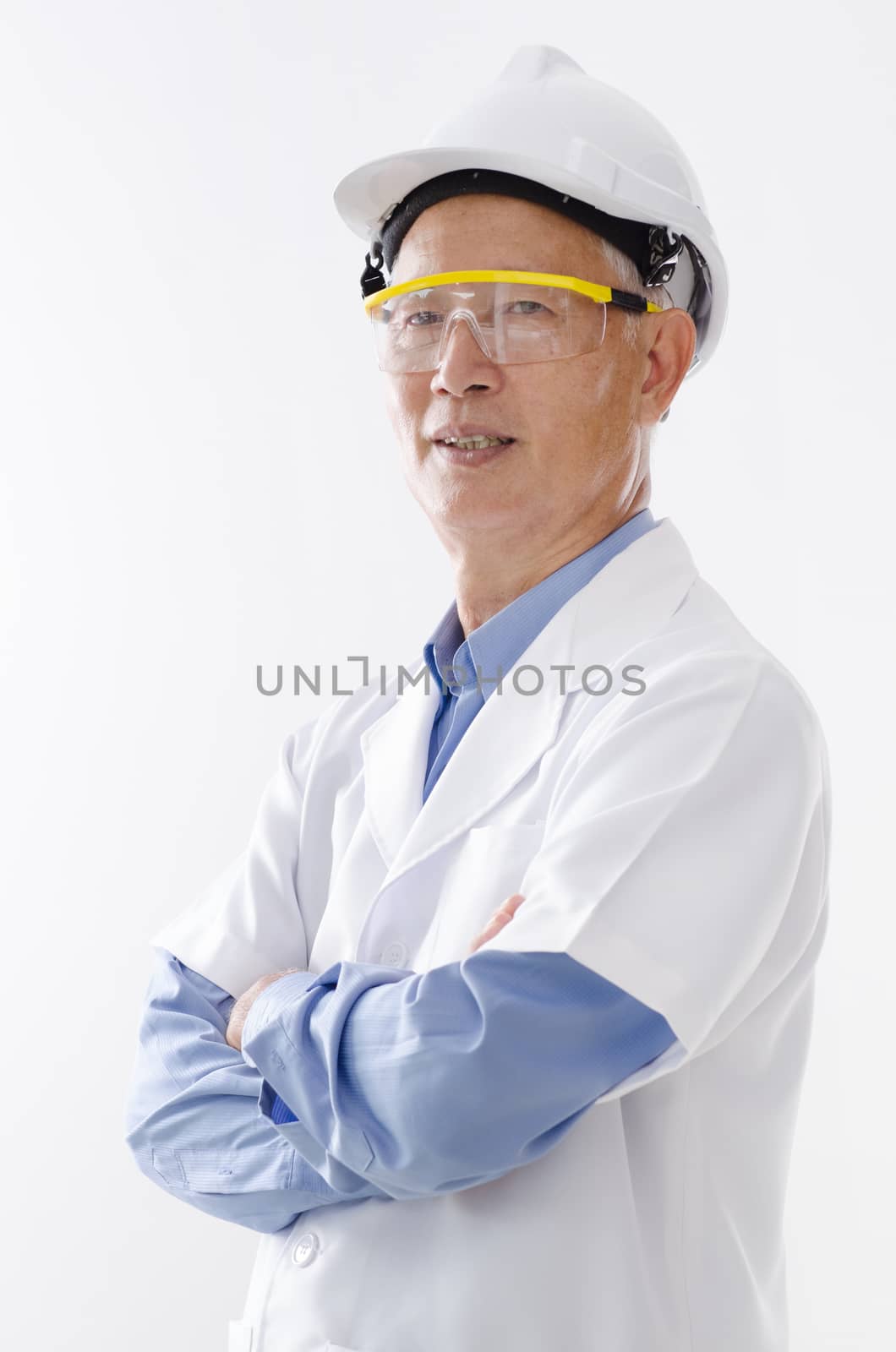 Portrait of Asian senior engineer with hard helmet and uniform, standing isolated on white background.