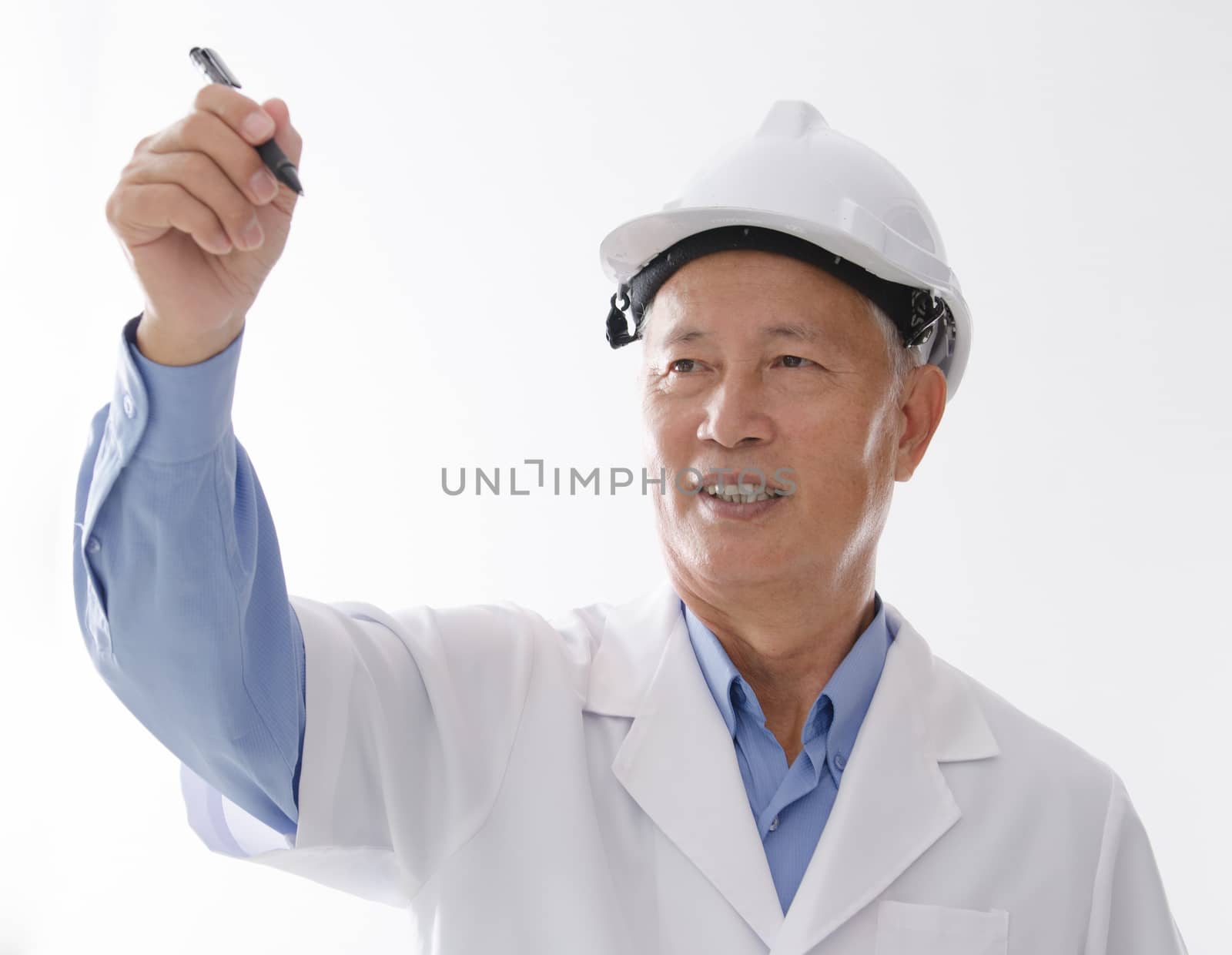 Portrait of Asian engineer with hard hat, hand writing on blank space, standing isolated on white background.