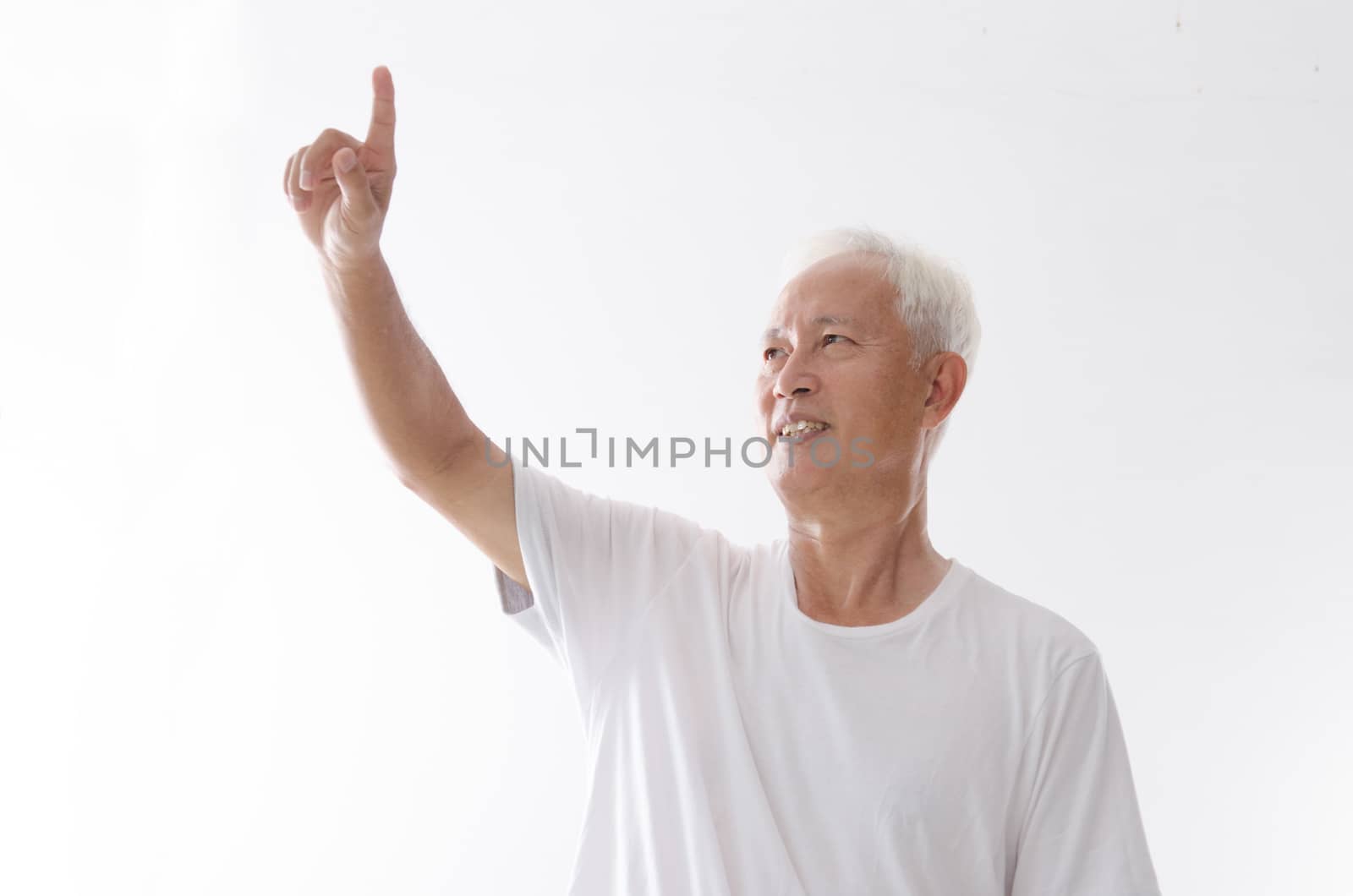 Portrait of old Asian man hand pointing on blank space, isolated on white background.