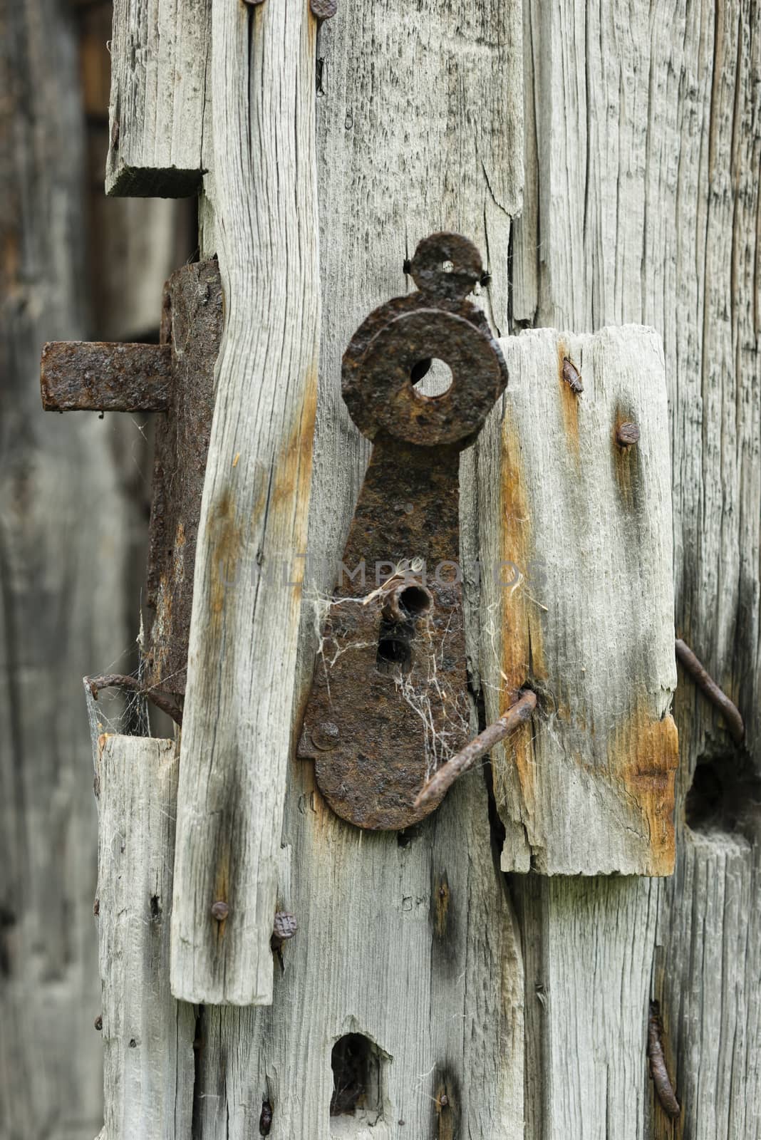 Old rusty lock in a mountain wooden cabin  by AlessandroZocc