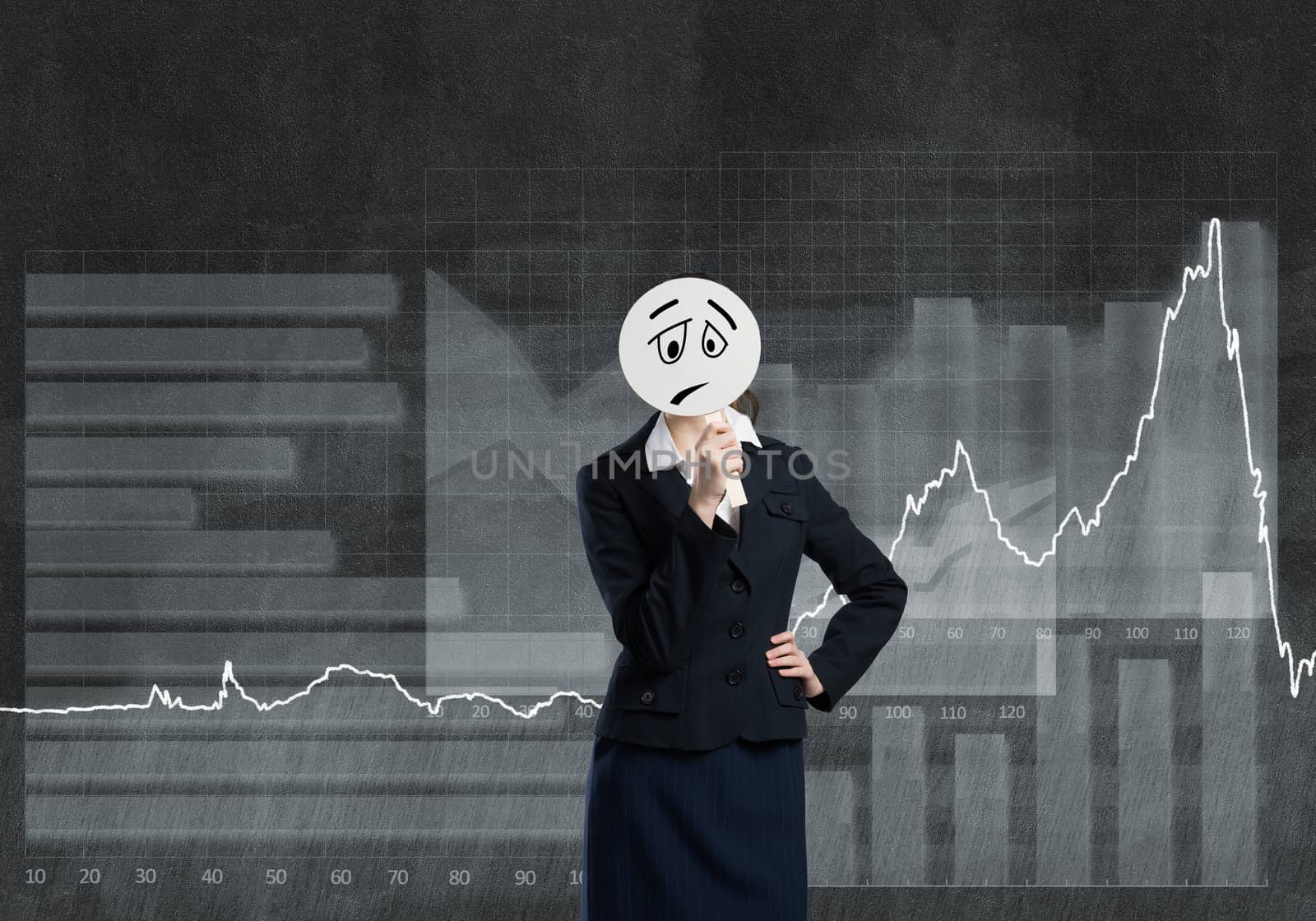 Businesswoman and graphs at background hiding her face behind mask