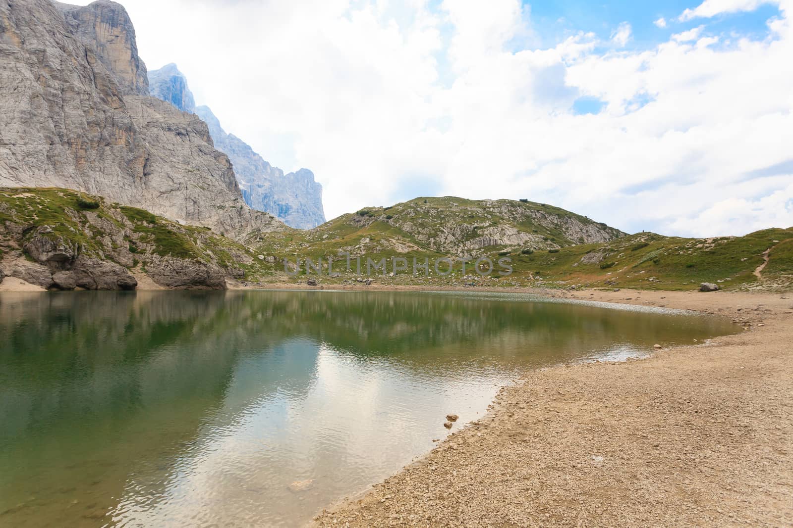 Alpine lake on italian Alps, dolomite, trekking