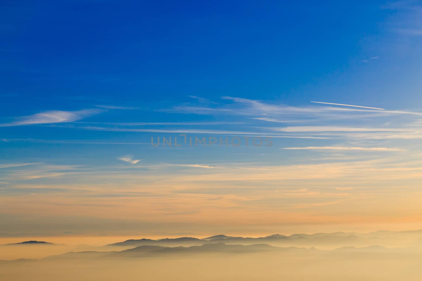 Mountain silhoutte over clouds, sky background, wallpaper