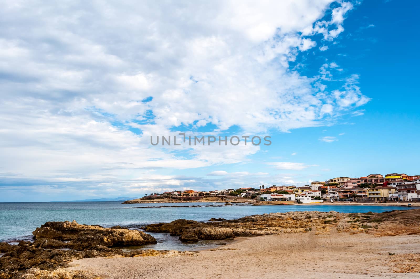 View of the beach inside the city of Porto Torres in a cloudy day of autumn