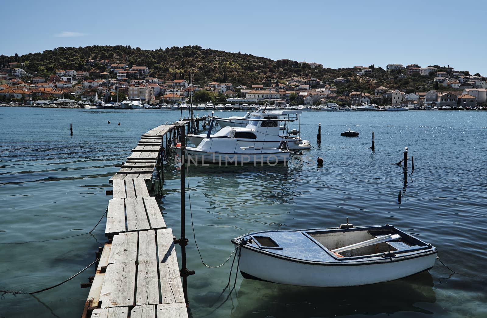 Motorboats on a wooden platform in Trogir, Croatia