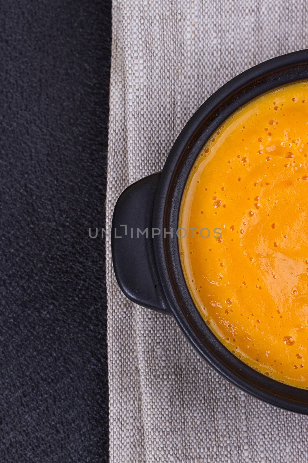 Pumpkin and carrot soup with cream and parsley by victosha