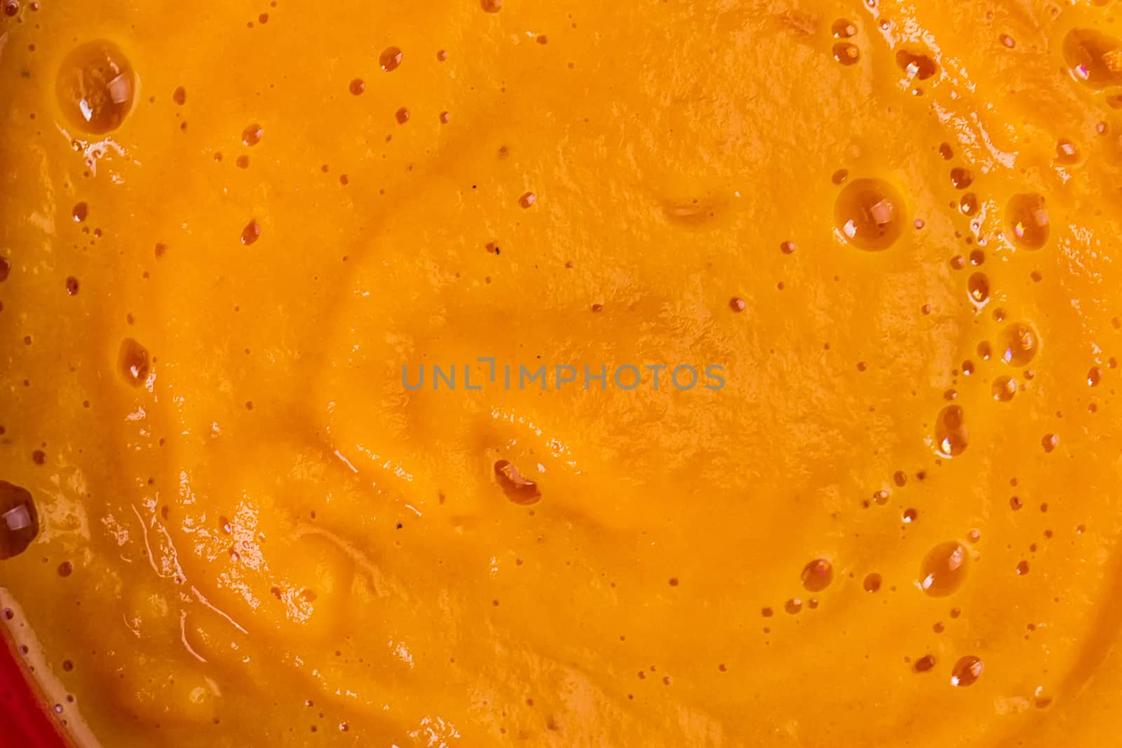 Texture of pumpkin soup close-up. Autumn dish