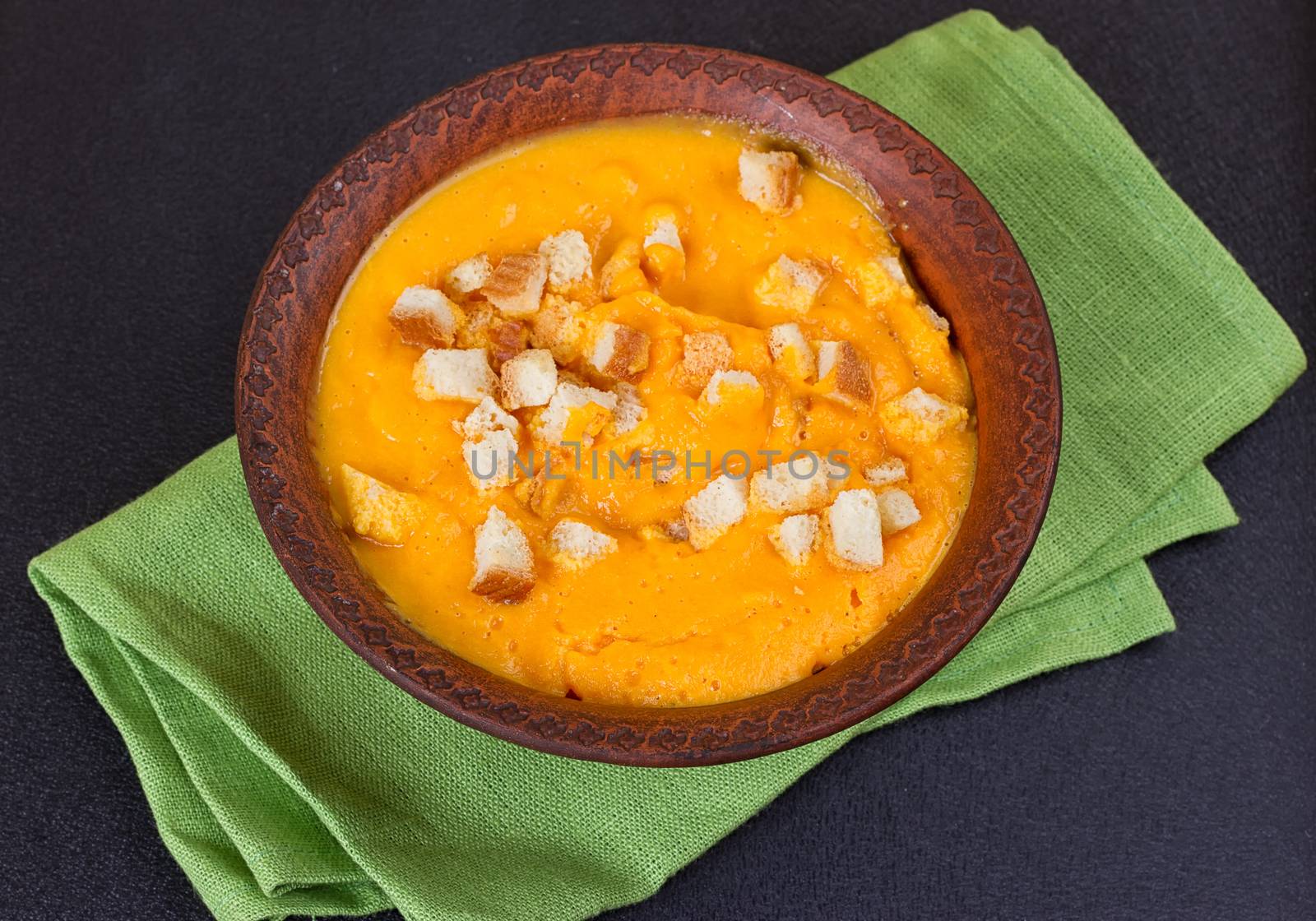 Pumpkin and carrot soup with cream and parsley by victosha