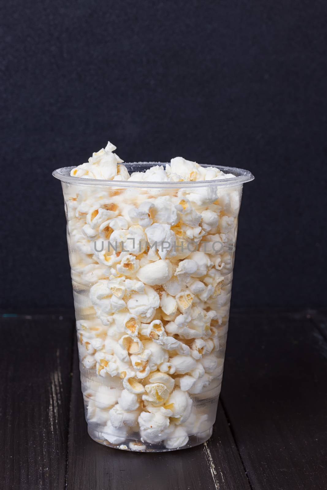 Popcorn in box on the black background