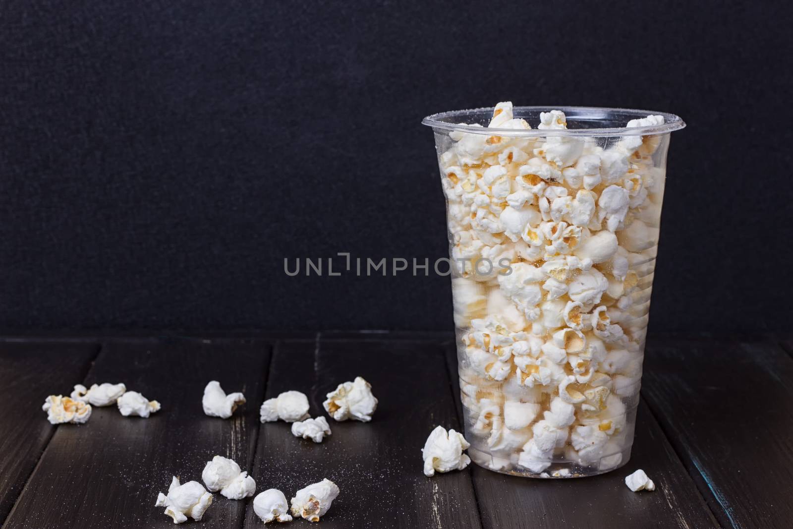 Popcorn in box on the black background