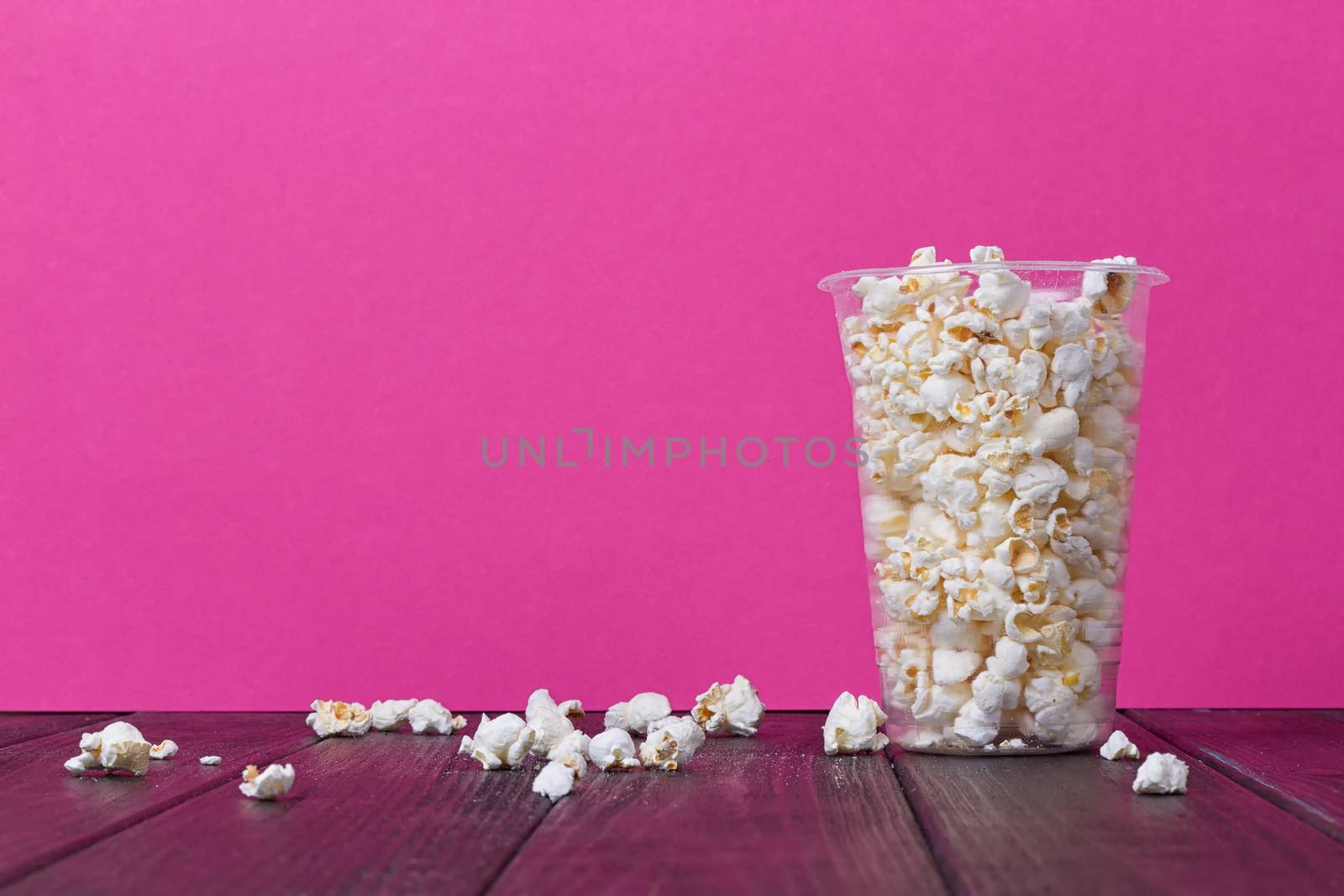 Popcorn In Bucket on the Pink Background.