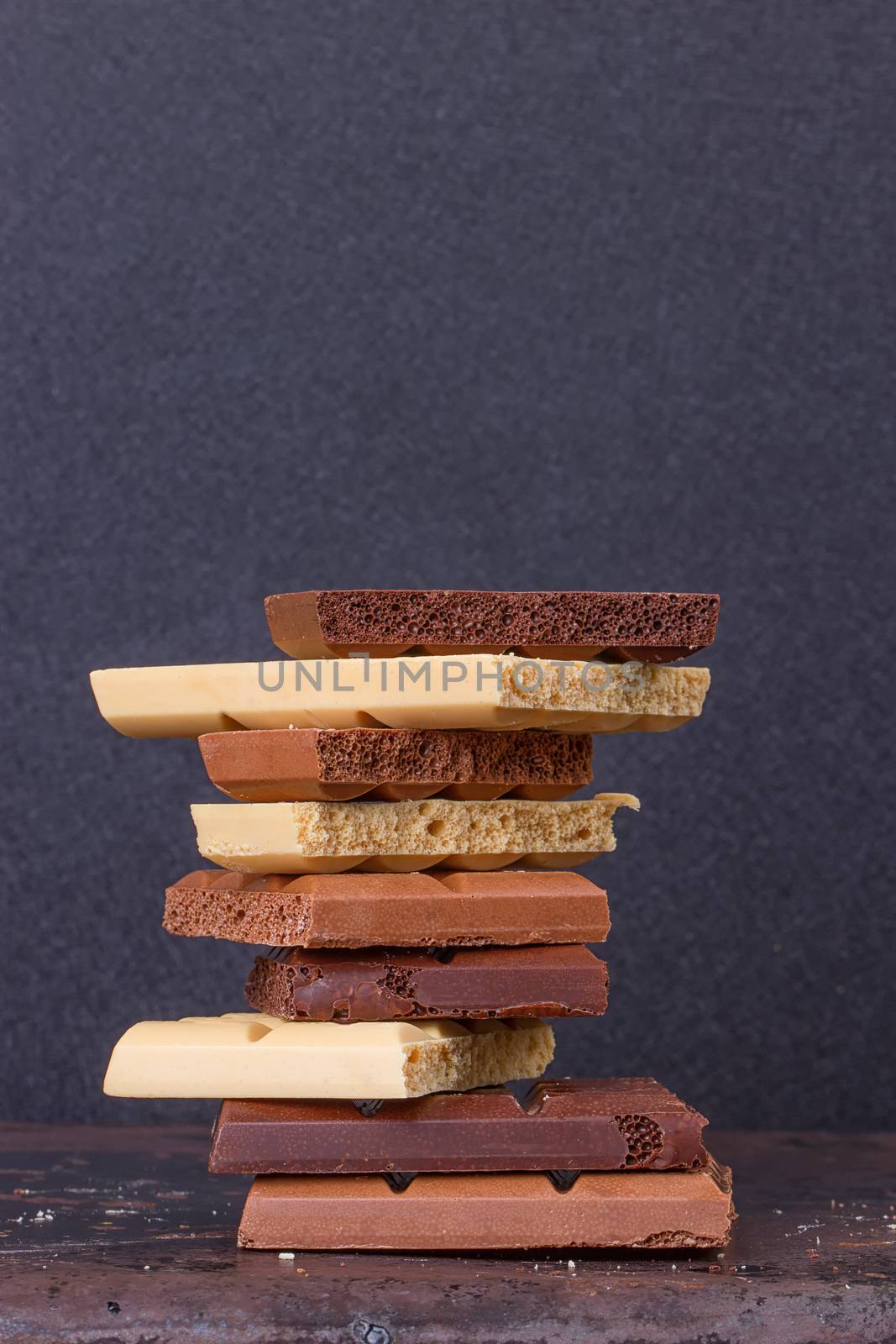 stack of different kind porous chocolate pieces by victosha