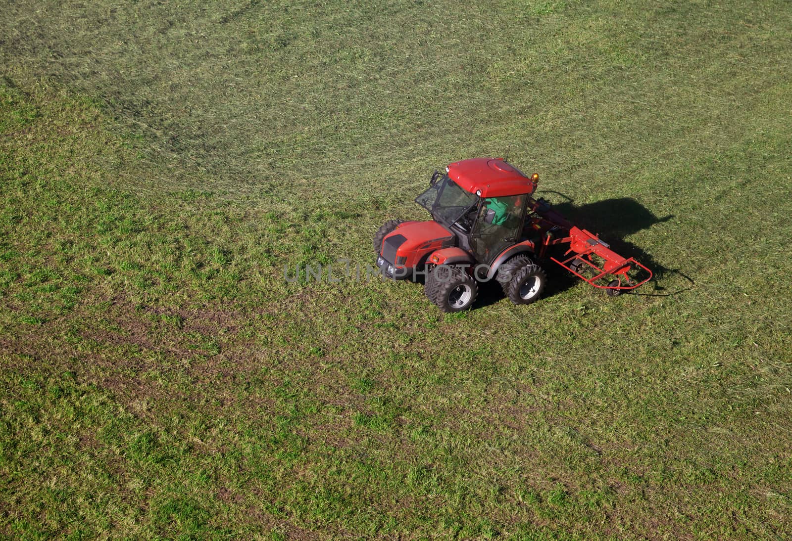 Small tractor in a field, view from above