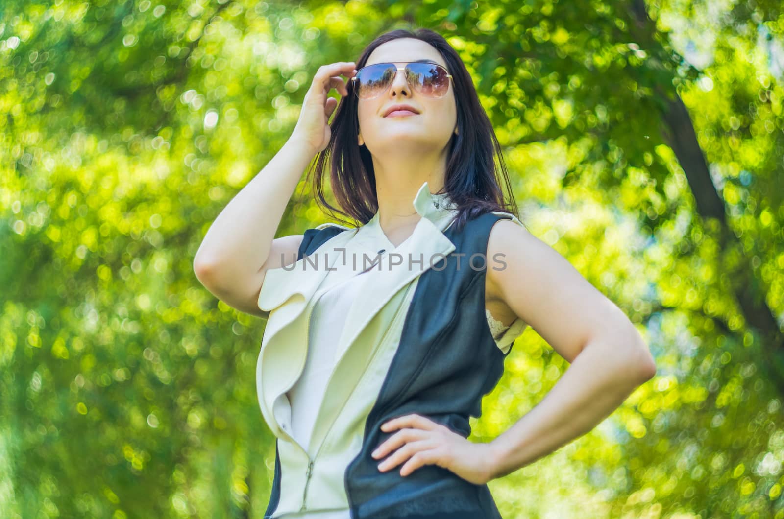 young caucasian business woman in stylish clothes in the park