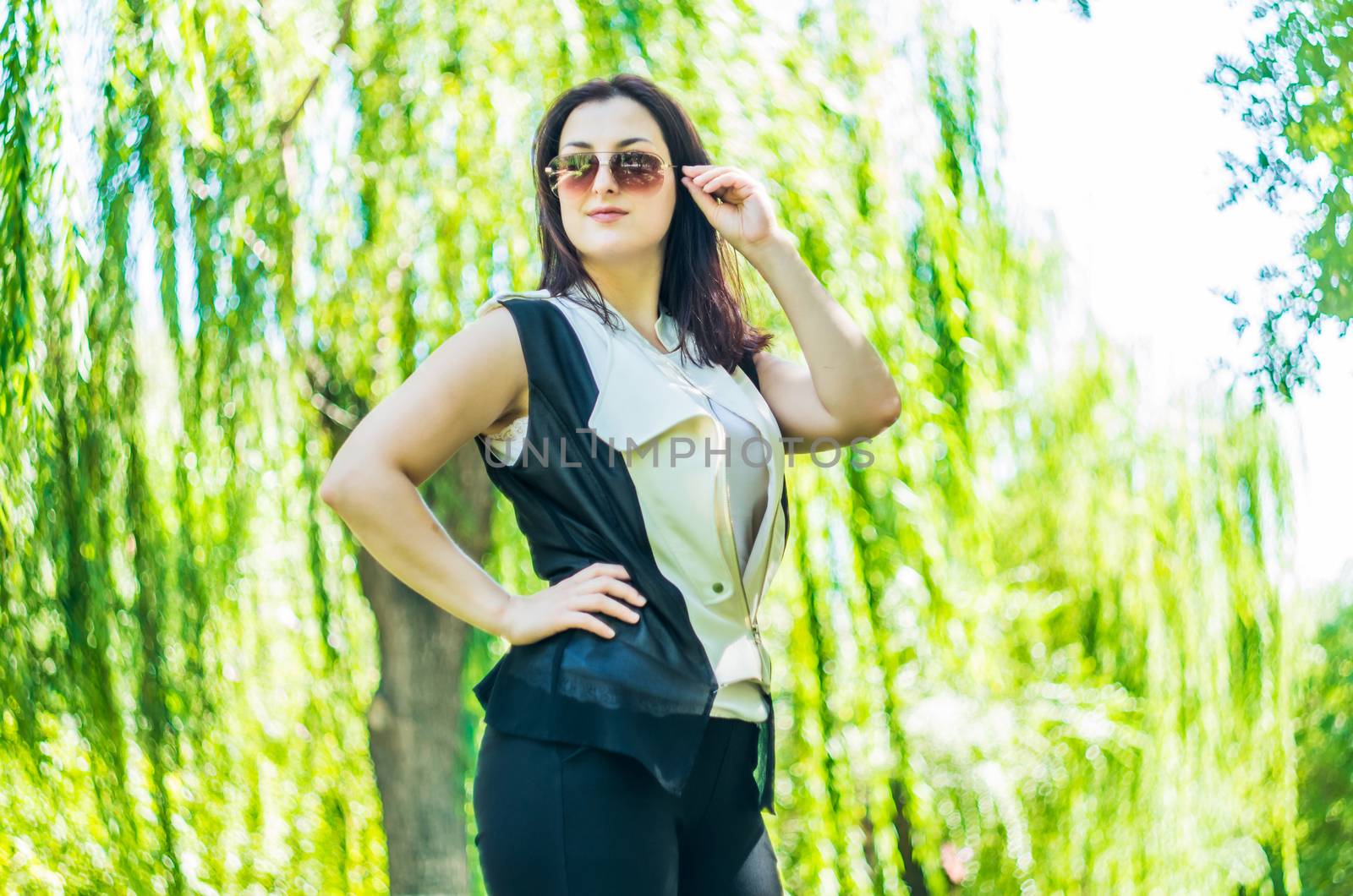 young caucasian business woman in stylish clothes in the park by Desperada
